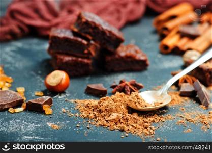 chocolate cake and cocoa powder on a table