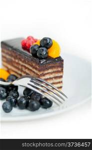 chocolate cake and fresh fruit on top closeup macro