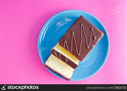 chocolate cake on colored background