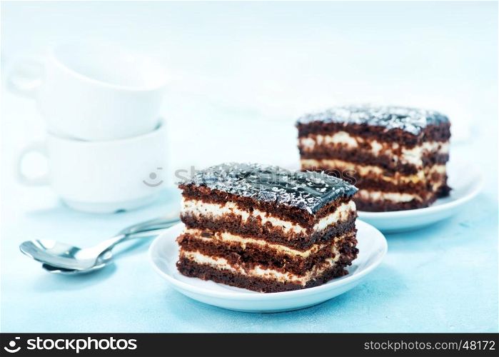 chocolate cake on plate and on a table