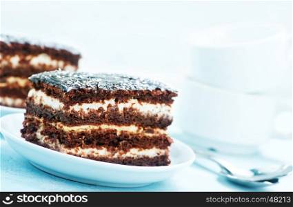 chocolate cake on plate and on a table