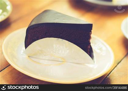 Chocolate cake on the table.film style color effect
