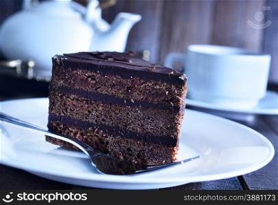 chocolate cake on white plate and on a table