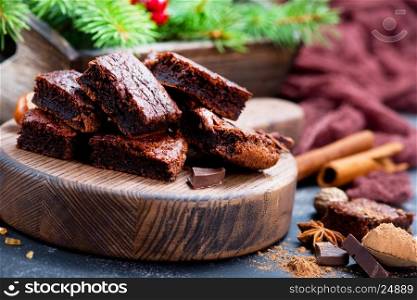 chocolate cake on wooden board and on a table