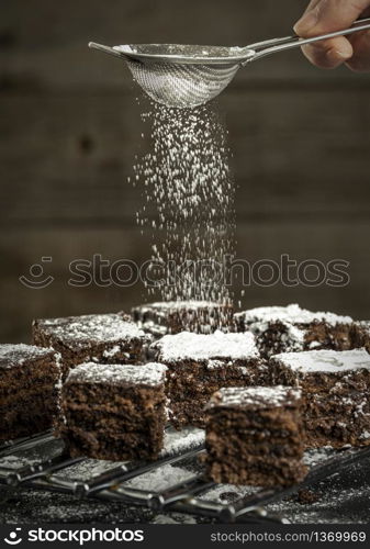 chocolate cake pieces sprinkled with icing sugar