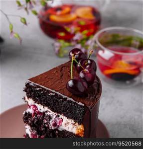 Chocolate cake with cherries and chocolate cream