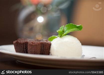 chocolate cake with ice cream. chocolate cake with ice cream at white plate
