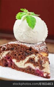 chocolate cake with jam ice cream. A slice of chocolate cake with ice cream
