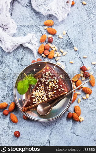 chocolate cake with nuts on a table