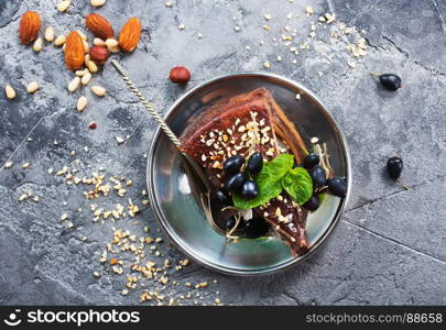 chocolate cake with nuts on a table