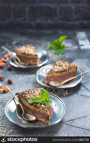 chocolate cake with nuts on a table