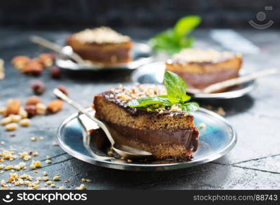 chocolate cake with nuts on a table