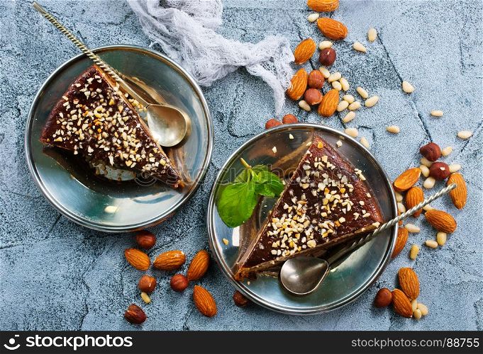chocolate cake with nuts on a table
