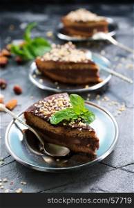 chocolate cake with nuts on the plate