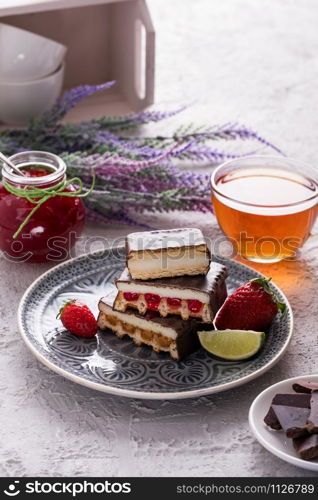 Chocolate cakes with fruits and tea for breakfast