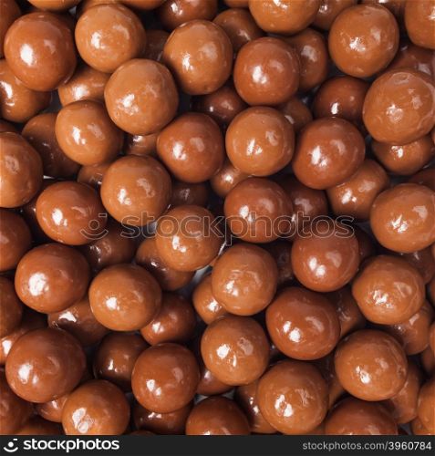 Chocolate candies background. Closeup brown chocolate candy background
