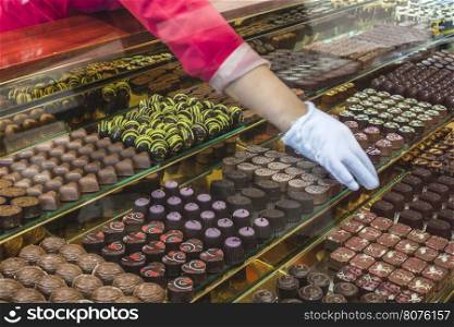 Chocolate candy in a store window. Stand with chocolates. Bulgaria
