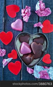 chocolate candy on the wooden table, chocolate hearts