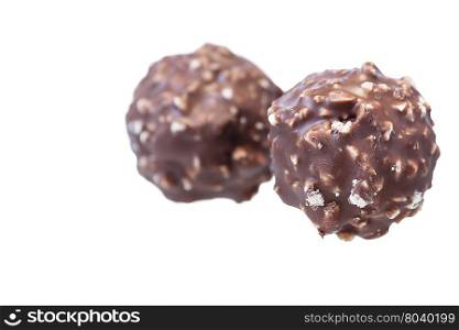 Chocolate candy with nuts, shallow focus