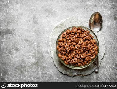 Chocolate cereal in a Cup. On the stone table.. Chocolate cereal in a Cup. On stone table.
