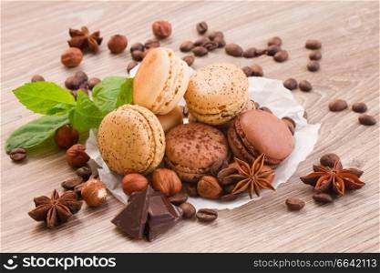 chocolate, coffee and numeg macaroons with ingredients on table