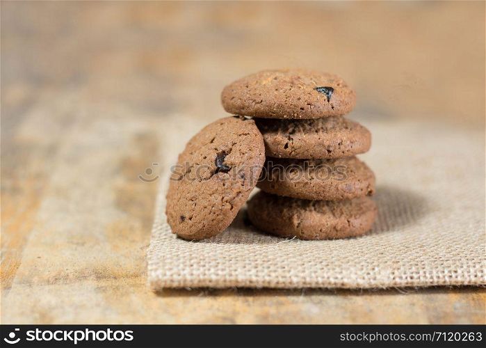 Chocolate cookies on linen fabric