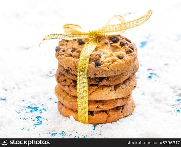Chocolate cookies on white linen napkin on wooden table