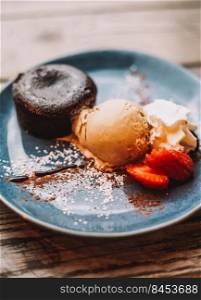 Chocolate coulant dessert with a scoop of ice cream