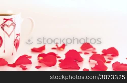 Chocolate cupcake and coffee with roses and gift at candlelight for a bright, fun and cheerful Valentines Day. Love and romance concept.