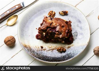 Chocolate cupcake or pie with berry and walnut. Brownie pie. Marble cake with cherries.