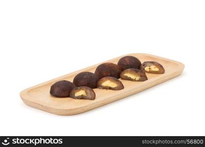 chocolate daifuku on wooden plate a?isolated on white background