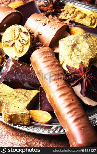 Chocolate delicious candy. Assortment of chocolate candies on stylish dish.Chocolate dessert.Chocolate sweets