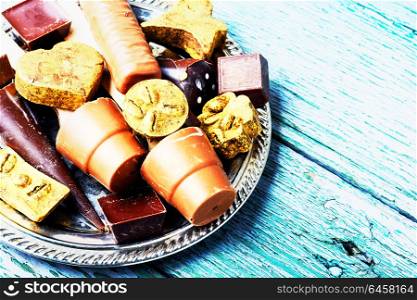 Chocolate delicious candy. Chocolate candies on stylish tray.Chocolate dessert.Luxury candy