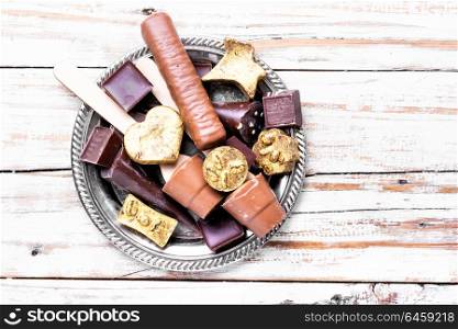 Chocolate delicious candy. Chocolate candies on stylish tray.Chocolate dessert.Luxury candy