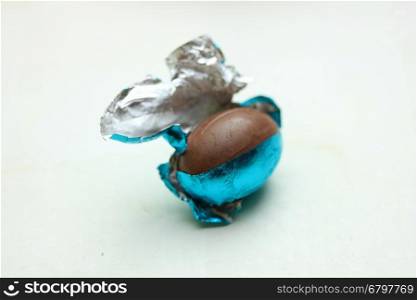 chocolate easter egg in blue metallic foil