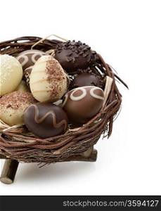 Chocolate Eggs Collection In A Nest On White Background