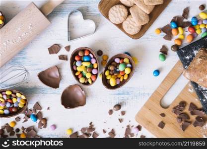 chocolate eggs with candies near pastry