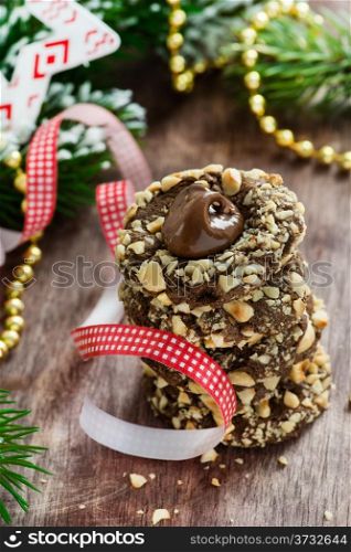 Chocolate filled cookies with hazelnuts, festive decorations, selective focus