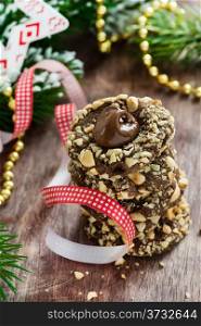 Chocolate filled cookies with hazelnuts, festive decorations, selective focus