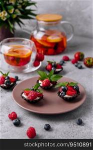 Chocolate ganache tarts with fresh berries