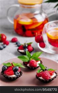 Chocolate ganache tarts with fresh berries