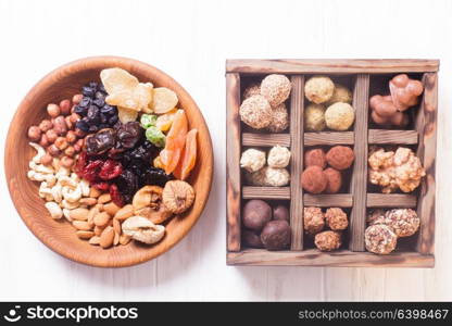 Chocolate handmade candies and dry nuts and fruits, healthy snacks. Healthy natural snacks