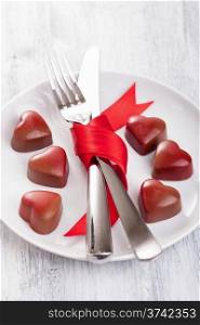 chocolate hearts and silverware on plate for Valentines