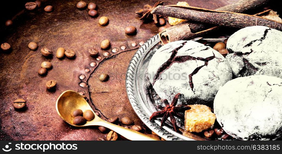 Chocolate homemade cookies with cracks to coffee. Chocolate cookies on dark retro table