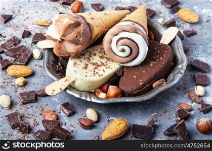 Chocolate ice cream background. tray with summer ice cream with chocolate filling and nuts