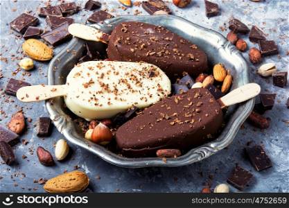 Chocolate ice cream background. tray with summer ice cream with chocolate filling and nuts