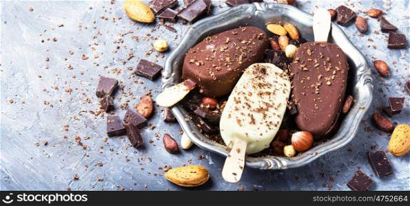 chocolate ice cream with almonds. Tray with summer ice cream with chocolate.Copy space