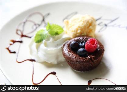 Chocolate lava cake and berries with ice cream