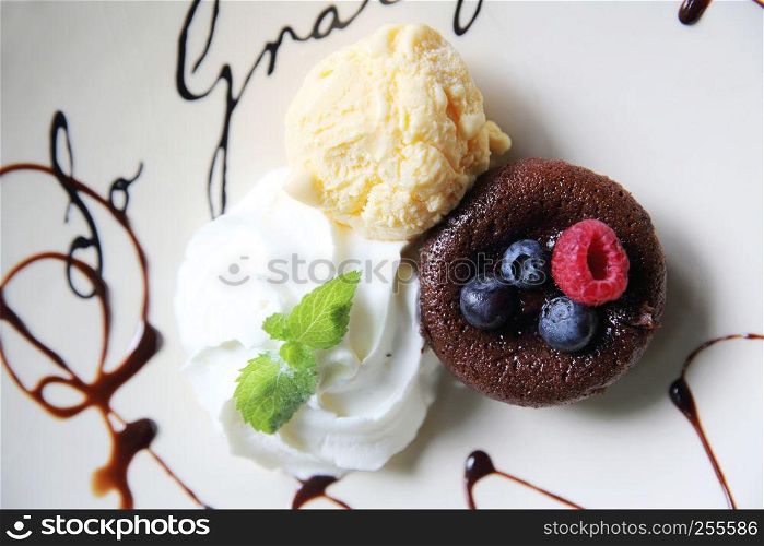 Chocolate lava cake and berries with ice cream