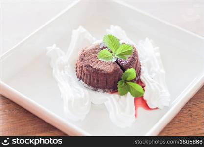 Chocolate lava with strawberry sauce, stock photo